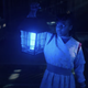 Erica Sinclair lights the way in the darkness in a scene from Stranger Things.